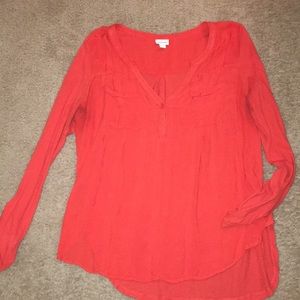 Red V-neck blouse
